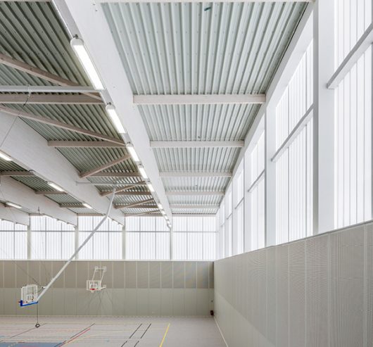 Sports complex in Bussy Saint-Georges, France featuring Kalwall wall system throughout gymnasium area